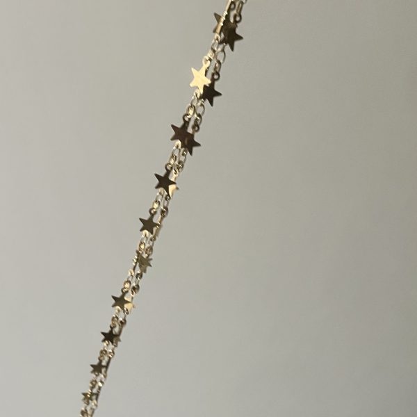 A Galaxy Of Charming Stars Necklace Worn Gold