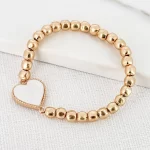 Gold Bead Stretch Bracelet with White Heart